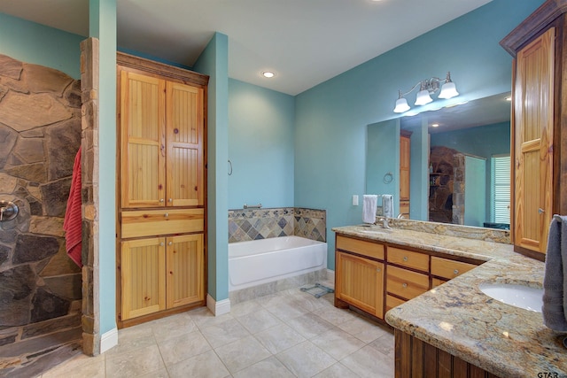 bathroom with independent shower and bath, tile patterned flooring, and vanity