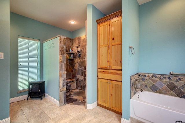 bathroom with separate shower and tub and tile patterned floors