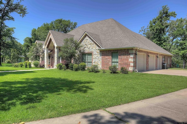 view of front of home featuring a garage and a front lawn