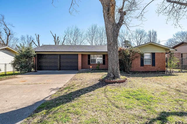 single story home featuring fence, concrete driveway, a front yard, an attached garage, and brick siding