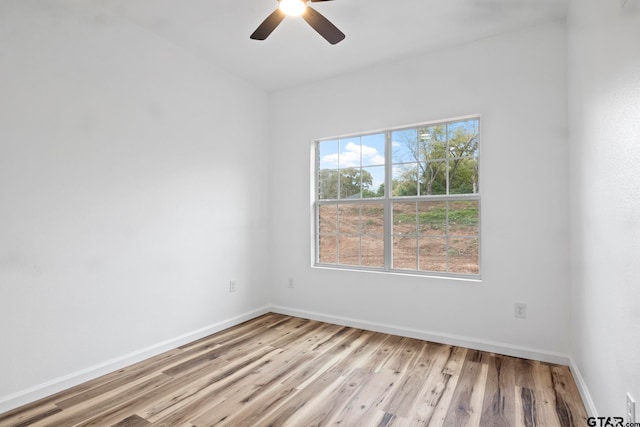 unfurnished room with light hardwood / wood-style flooring and ceiling fan