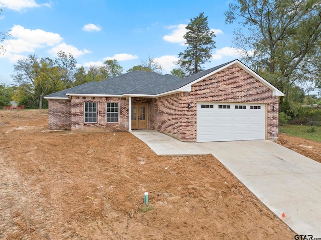 ranch-style home with a garage