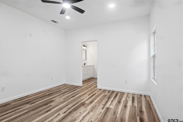 unfurnished room featuring light hardwood / wood-style floors and ceiling fan