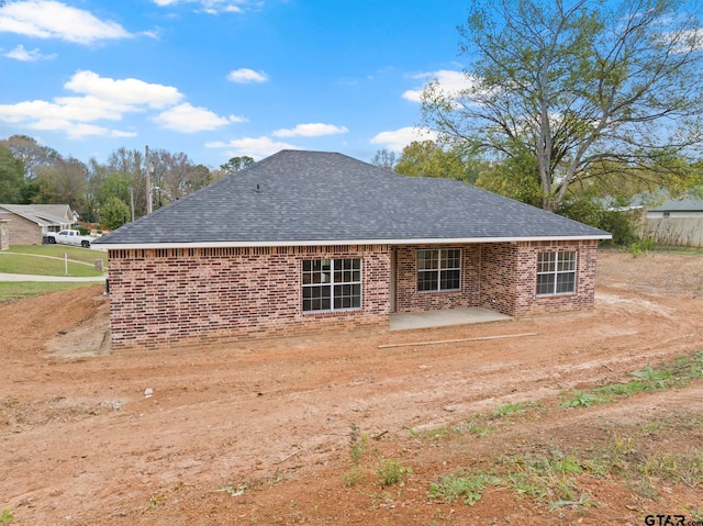 back of property with a patio area