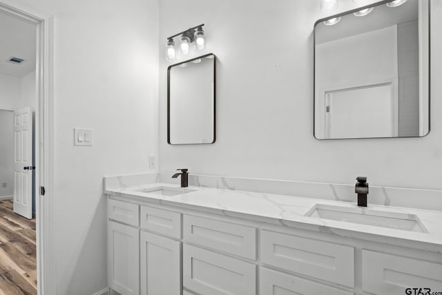 bathroom featuring hardwood / wood-style floors and vanity