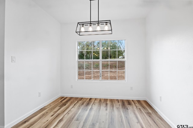 unfurnished dining area with light hardwood / wood-style flooring