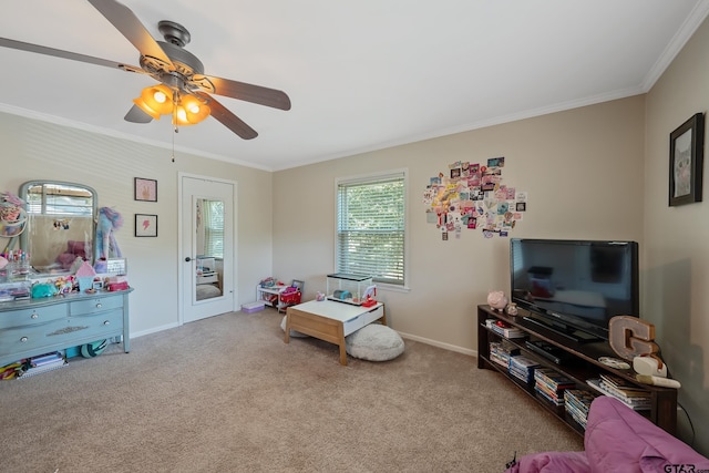 playroom with ceiling fan, carpet flooring, and ornamental molding