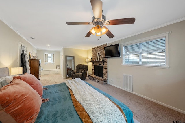 bedroom featuring a fireplace, light carpet, ceiling fan, and crown molding