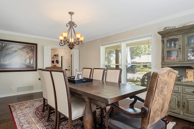 dining space with dark hardwood / wood-style flooring, a chandelier, and ornamental molding