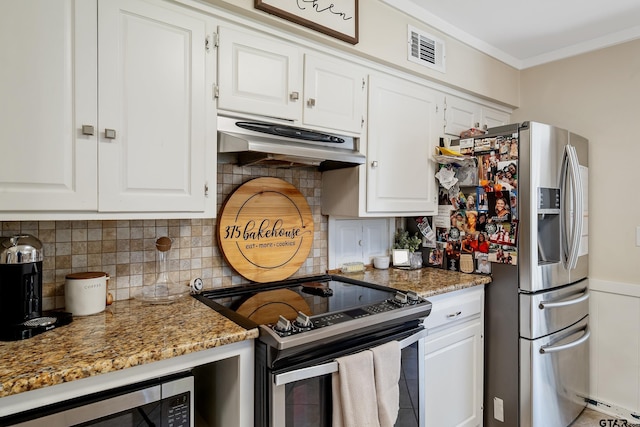 kitchen with stone countertops, white cabinetry, and appliances with stainless steel finishes