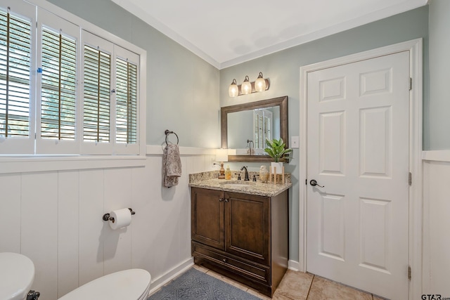 bathroom with vanity, tile patterned floors, and toilet