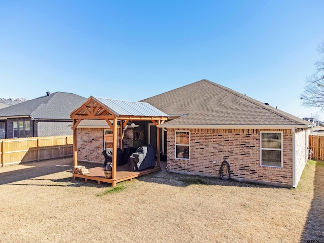 back of house featuring a wooden deck