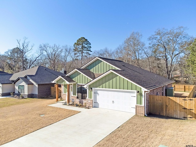 view of front of property featuring a garage and a front lawn