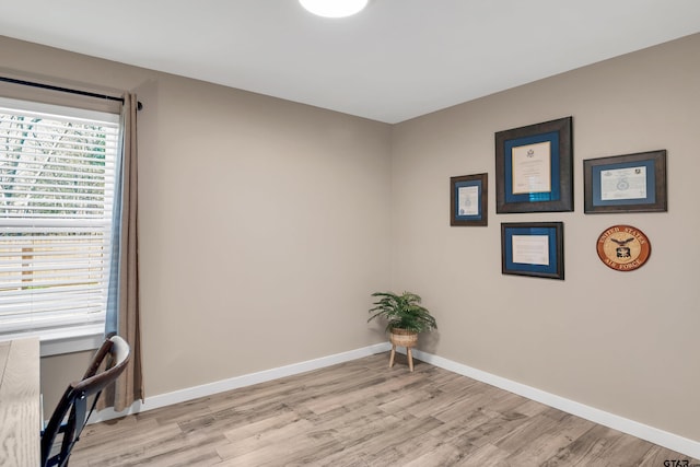 spare room with light wood-type flooring