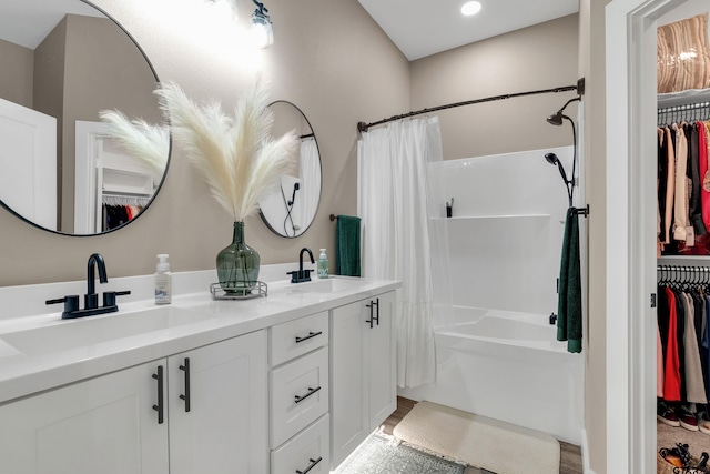 bathroom featuring vanity and shower / bath combo with shower curtain