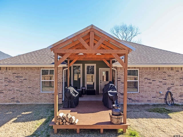 back of house with a wooden deck