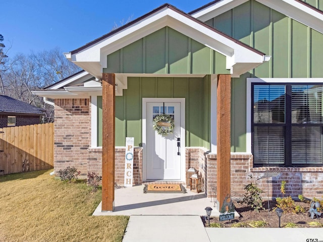 doorway to property with a yard