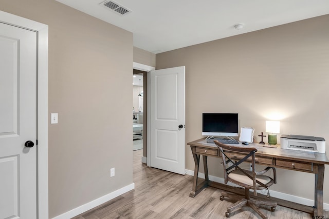 office area with light wood-type flooring