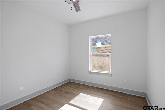 unfurnished room featuring ceiling fan and light hardwood / wood-style floors