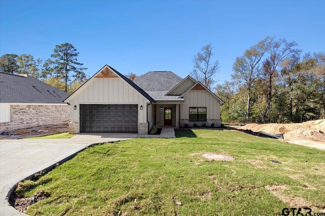 modern farmhouse with a front yard and a garage