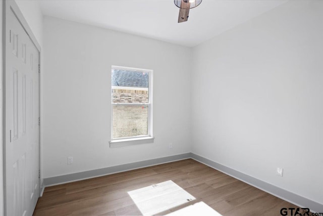 unfurnished bedroom featuring ceiling fan and light wood-type flooring