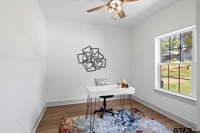 home office featuring wood-type flooring and ceiling fan