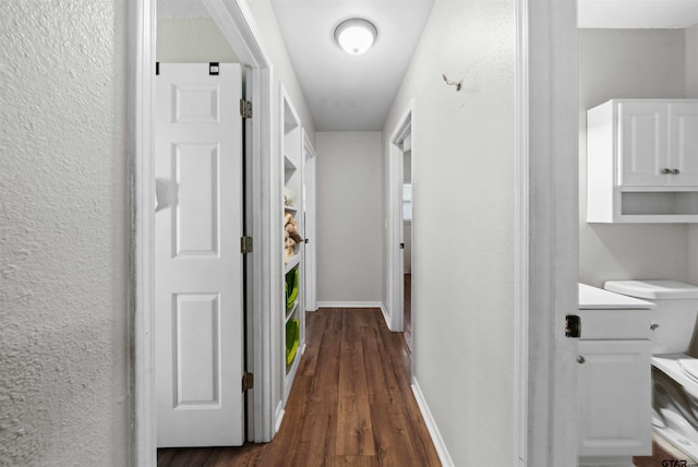 hallway featuring dark wood-type flooring