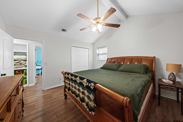 bedroom with dark hardwood / wood-style flooring, lofted ceiling with beams, a closet, and ceiling fan