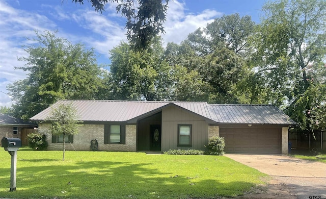 single story home with a garage and a front yard