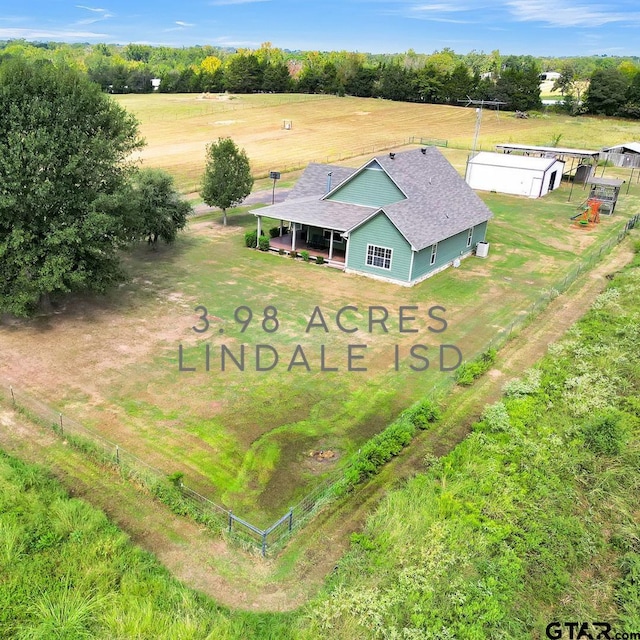 birds eye view of property featuring a rural view