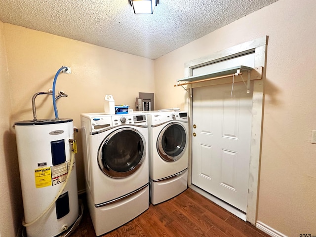 laundry room featuring electric water heater, a textured ceiling, dark wood-type flooring, and independent washer and dryer