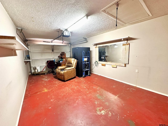 garage with a garage door opener and black refrigerator