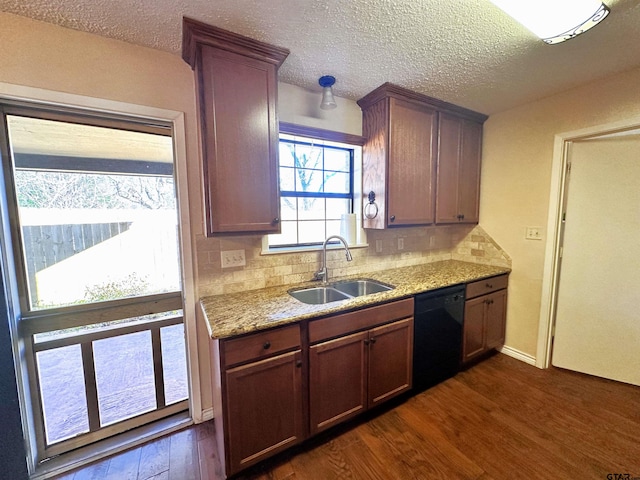 kitchen featuring dark hardwood / wood-style flooring, dishwasher, a textured ceiling, sink, and backsplash