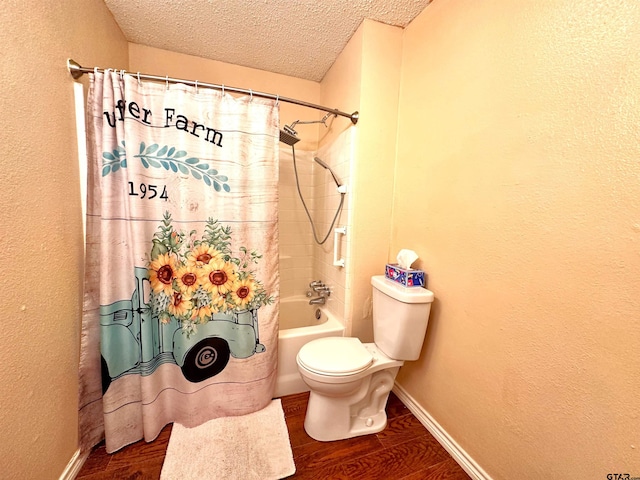 bathroom featuring hardwood / wood-style floors, shower / bath combo with shower curtain, a textured ceiling, and toilet