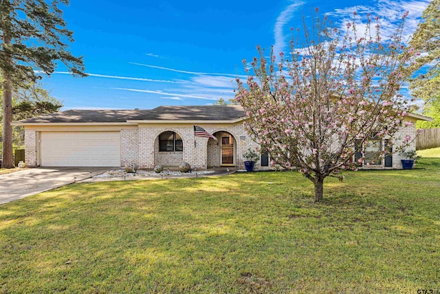 2207 Pinecrest Dr, Gladewater, TX 75647 - view of front of home featuring concrete driveway, a garage, a front lawn, and brick siding