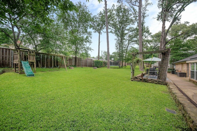 1018 Pollard Dr, Tyler, TX 75701 - view of yard with a patio and a playground