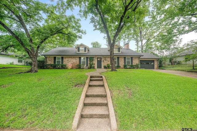 1018 Pollard Dr, Tyler, TX 75701 - view of front of house featuring driveway, brick siding, an attached garage, a front lawn, and a chimney