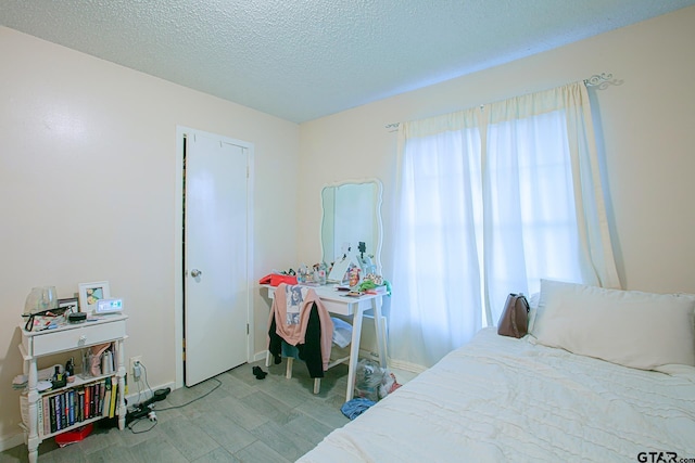 bedroom featuring a textured ceiling