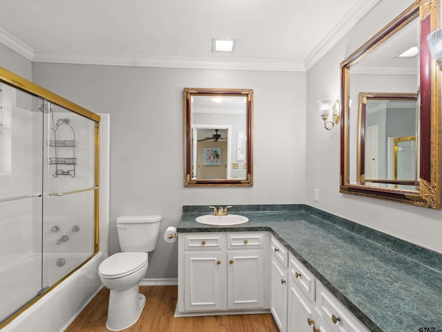 2808 Tryon Rd, Longview, TX 75605 - full bathroom with hardwood / wood-style flooring, bath / shower combo with glass door, vanity, ornamental molding, and toilet