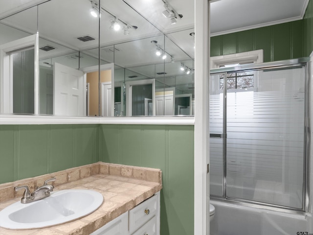 2808 Tryon Rd, Longview, TX 75605 - full bathroom with vanity, shower / bath combination with glass door, and toilet
