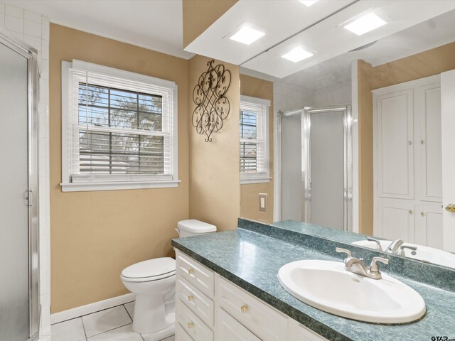 2808 Tryon Rd, Longview, TX 75605 - bathroom featuring a shower with shower door, vanity, ornamental molding, toilet, and tile patterned floors