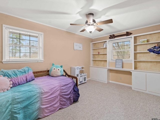 2808 Tryon Rd, Longview, TX 75605 - bedroom with ornamental molding, carpet floors, built in desk, and ceiling fan
