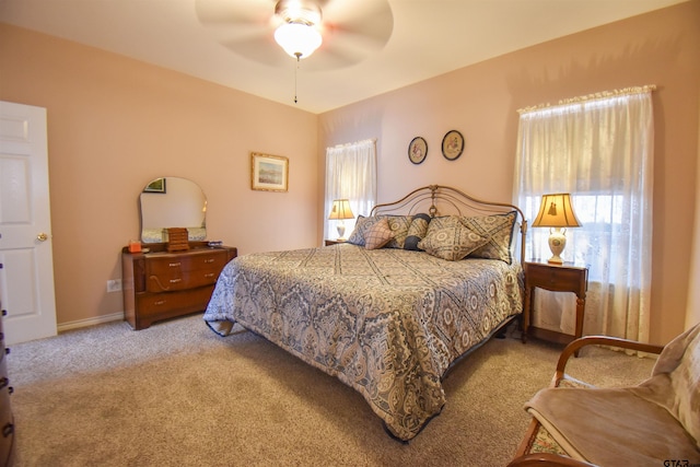 bedroom featuring light carpet and ceiling fan