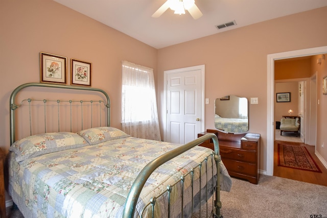 carpeted bedroom featuring ceiling fan