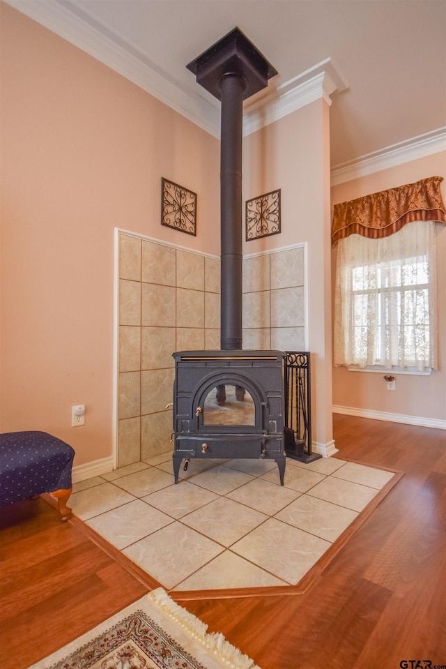 interior details featuring ornamental molding, wood-type flooring, and a wood stove