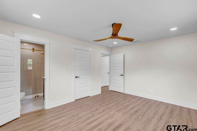 8100 Jewell Ln, Tyler, TX 75703 - unfurnished bedroom featuring wood finished floors, ensuite bathroom, recessed lighting, baseboards, and ceiling fan