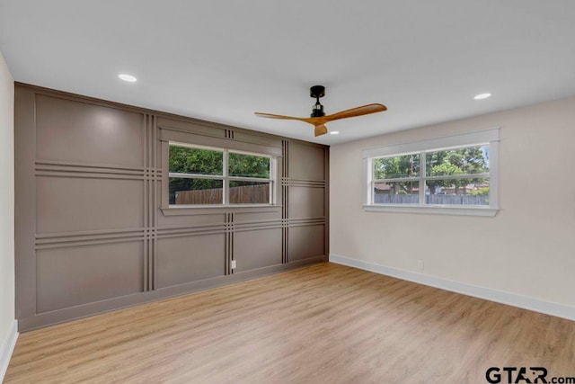 8100 Jewell Ln, Tyler, TX 75703 - unfurnished bedroom featuring baseboards, wood finished floors, a decorative wall, recessed lighting, and a ceiling fan