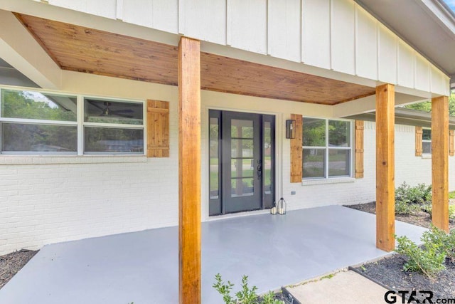 8100 Jewell Ln, Tyler, TX 75703 - view of exterior entry with brick siding and board and batten siding