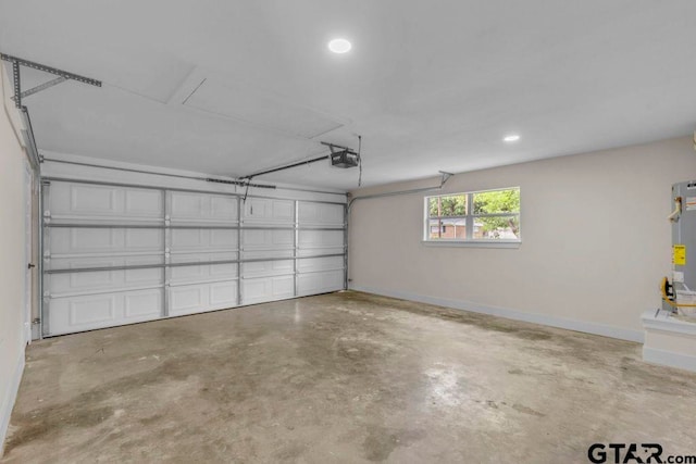 8100 Jewell Ln, Tyler, TX 75703 - garage with a garage door opener, recessed lighting, and baseboards
