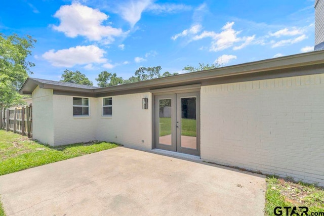 8100 Jewell Ln, Tyler, TX 75703 - back of house featuring french doors, a patio, and brick siding